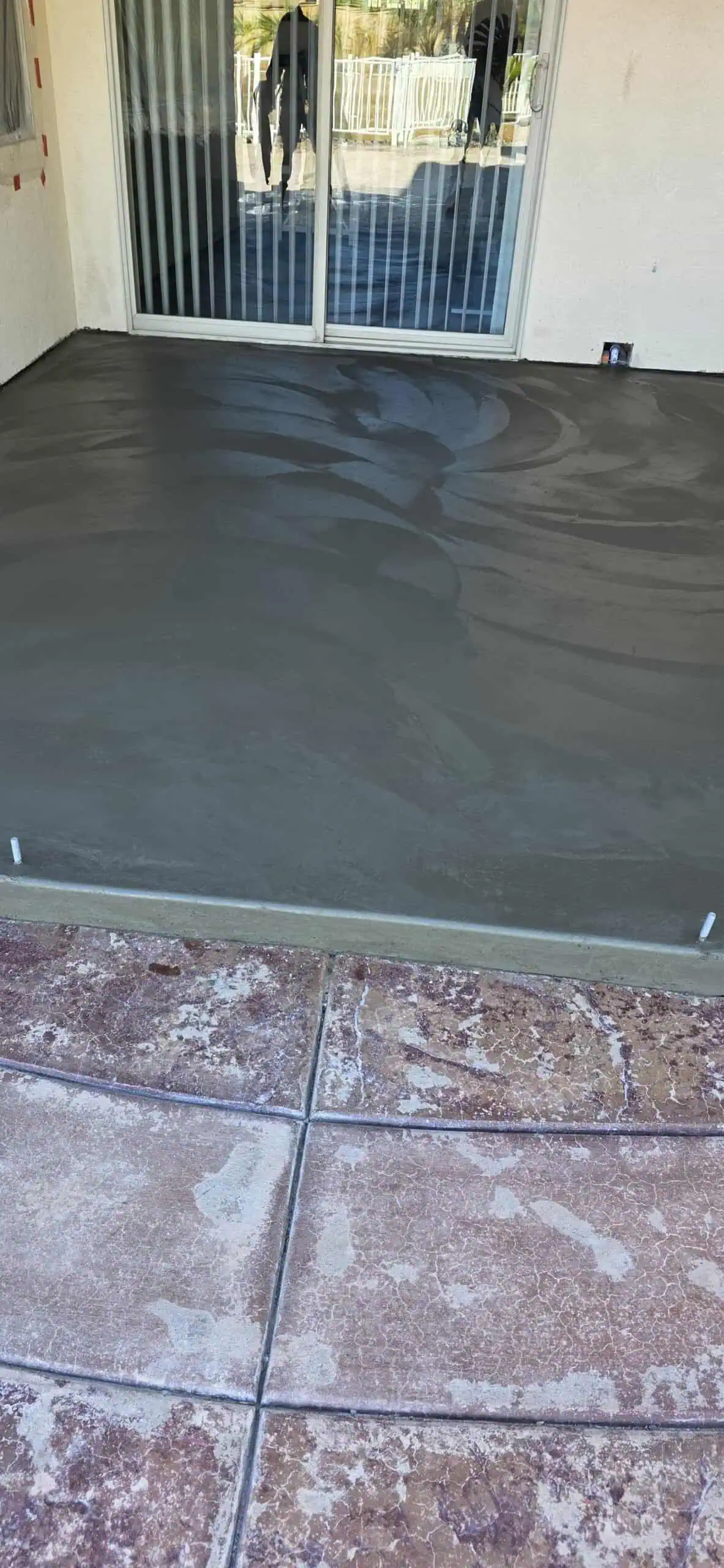 New concrete patio with smooth finish installed by AC Masonry INC.